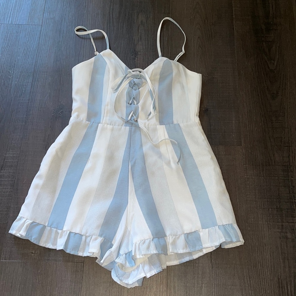 White and blue romper with adjuster straps
